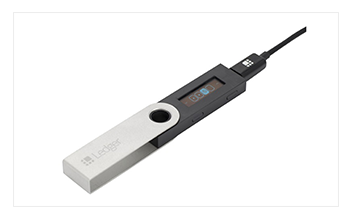 Ledger hardware wallet connected with USB cable